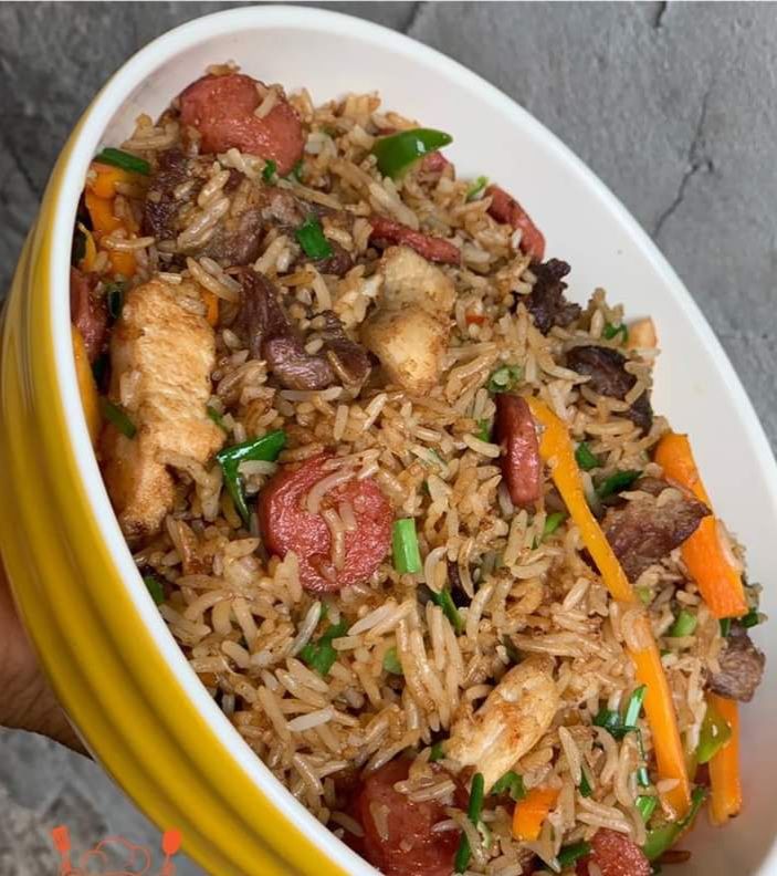 Basmati friedrice/friedchicken/assorted meat/coleslaw/Sweetplantain with green pepper sauce 