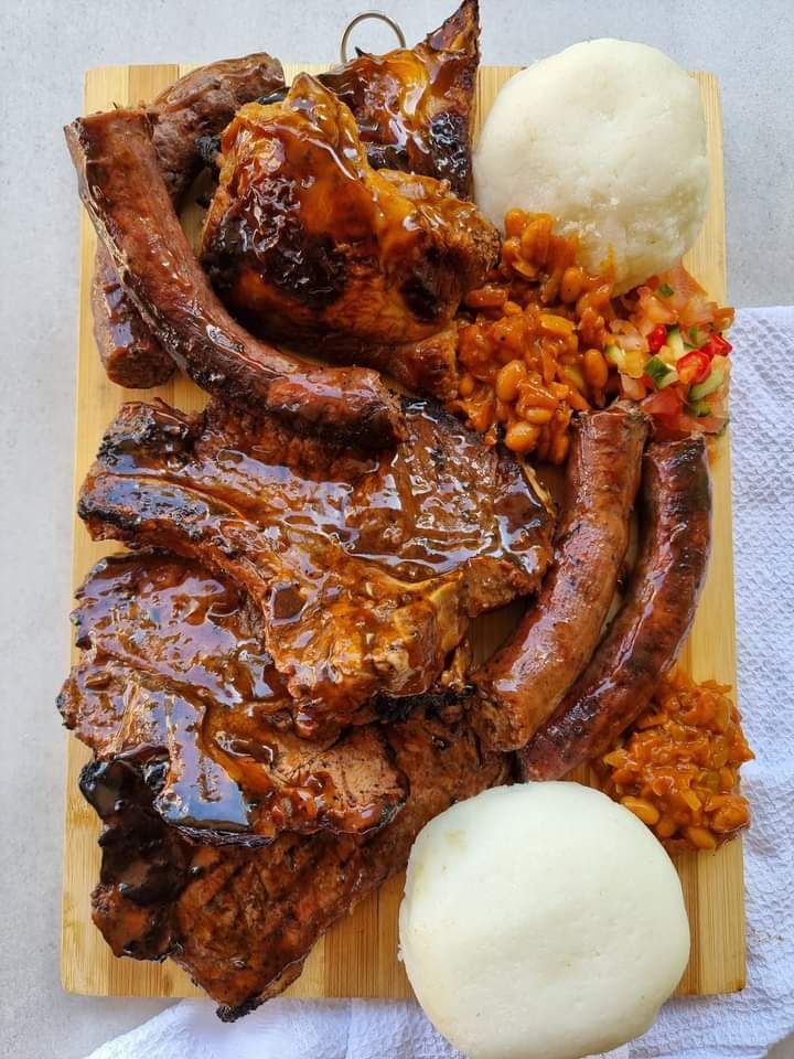 Meat barbecue platter with pap or rolls, hot salsa and Chakalaka