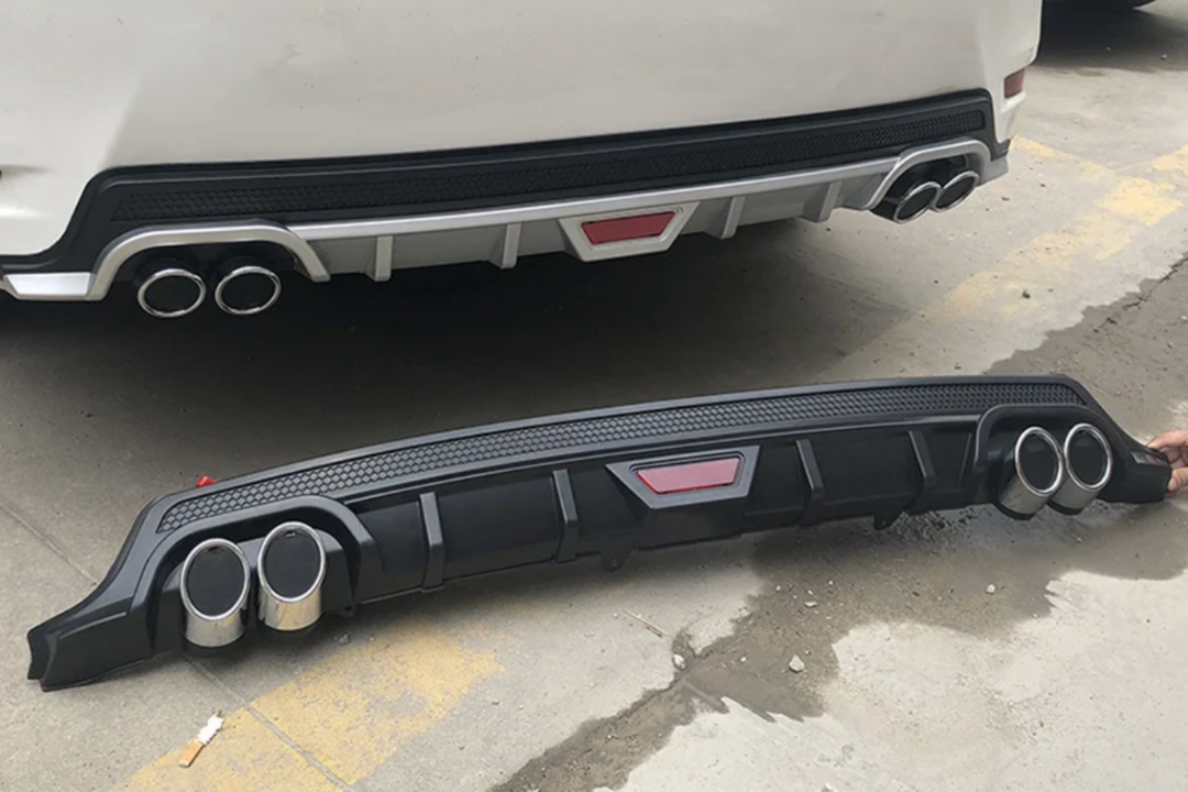 Rear diffuser lip with false exhaust ends 