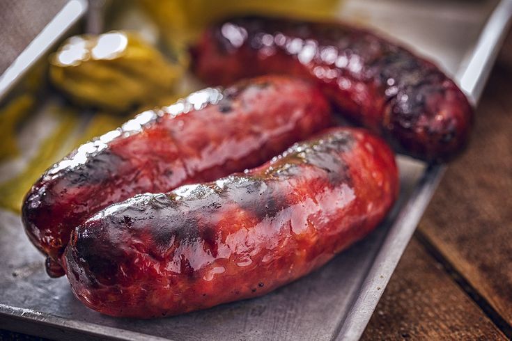 CHIPS & A PAIR OF SAUSAGES SERVED WITH (A COMPLIMENTARY) GLASS OF JUICE IN SEASON