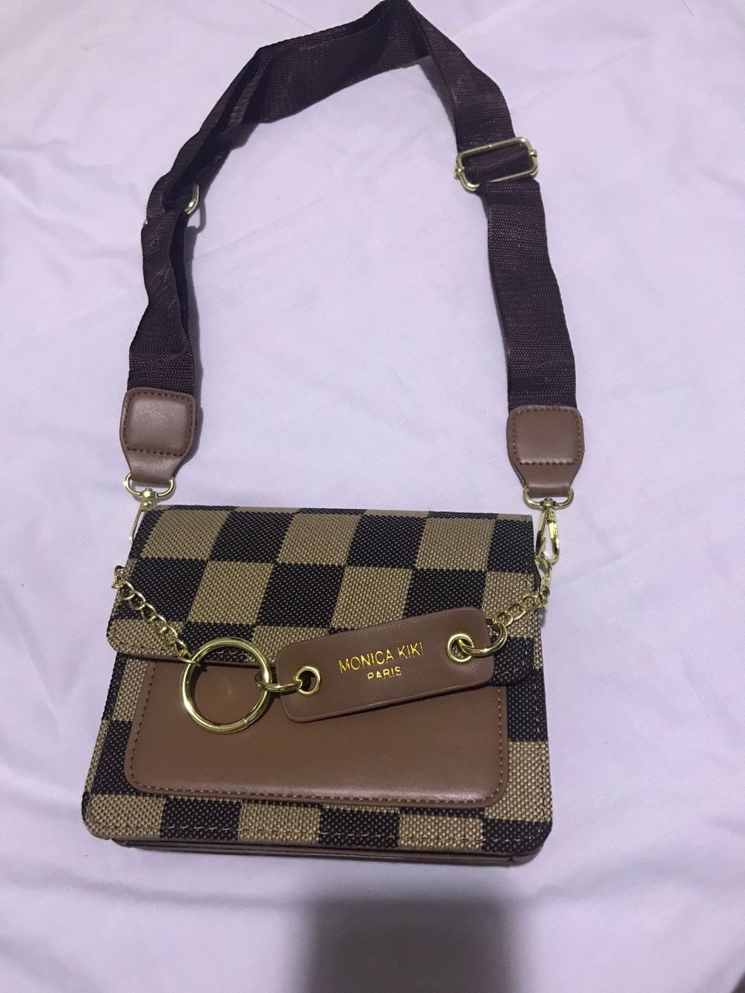 Geometric print sling bag.