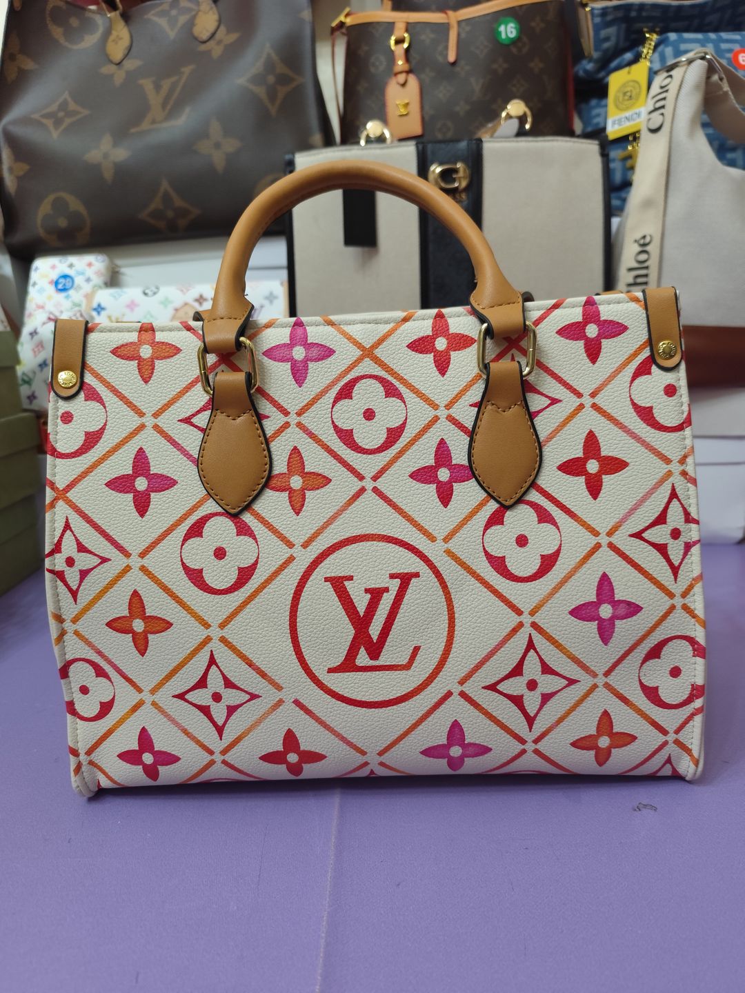 Bolsos LV, onthego mediano, coral y blanco 