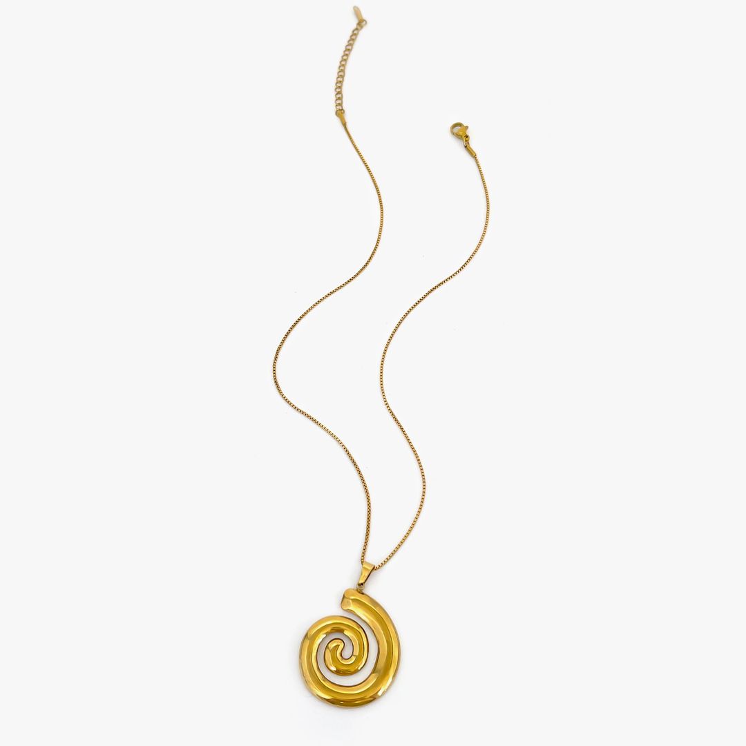 Spirale Céleste Dorée — ton bijou doré de l’été.