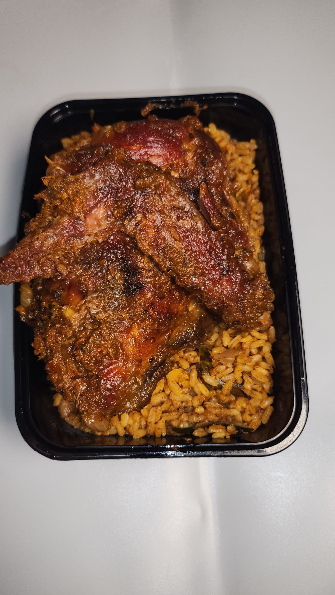 Get our 4-portion party Jollof rice with: Big Chicken