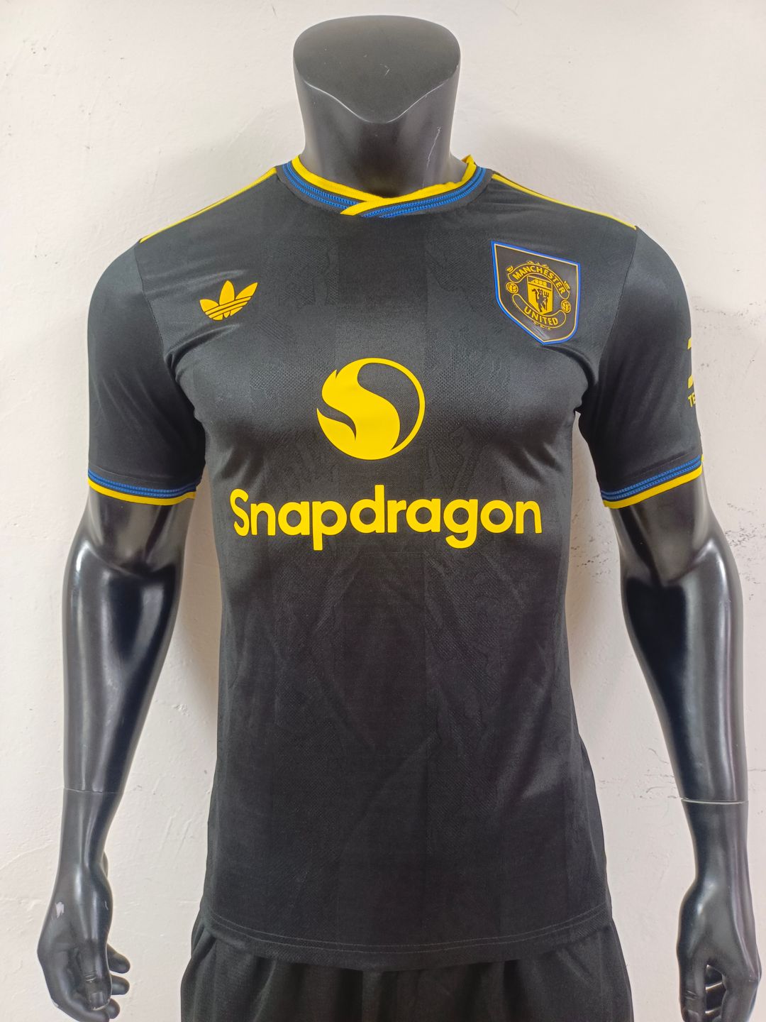 Manchester United 2025/26 Home Shirt (Black / Yellow / Blue)