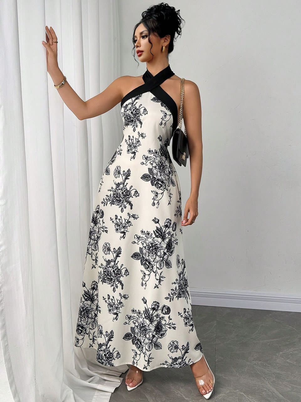 backless halter maxi dress with a bold bow