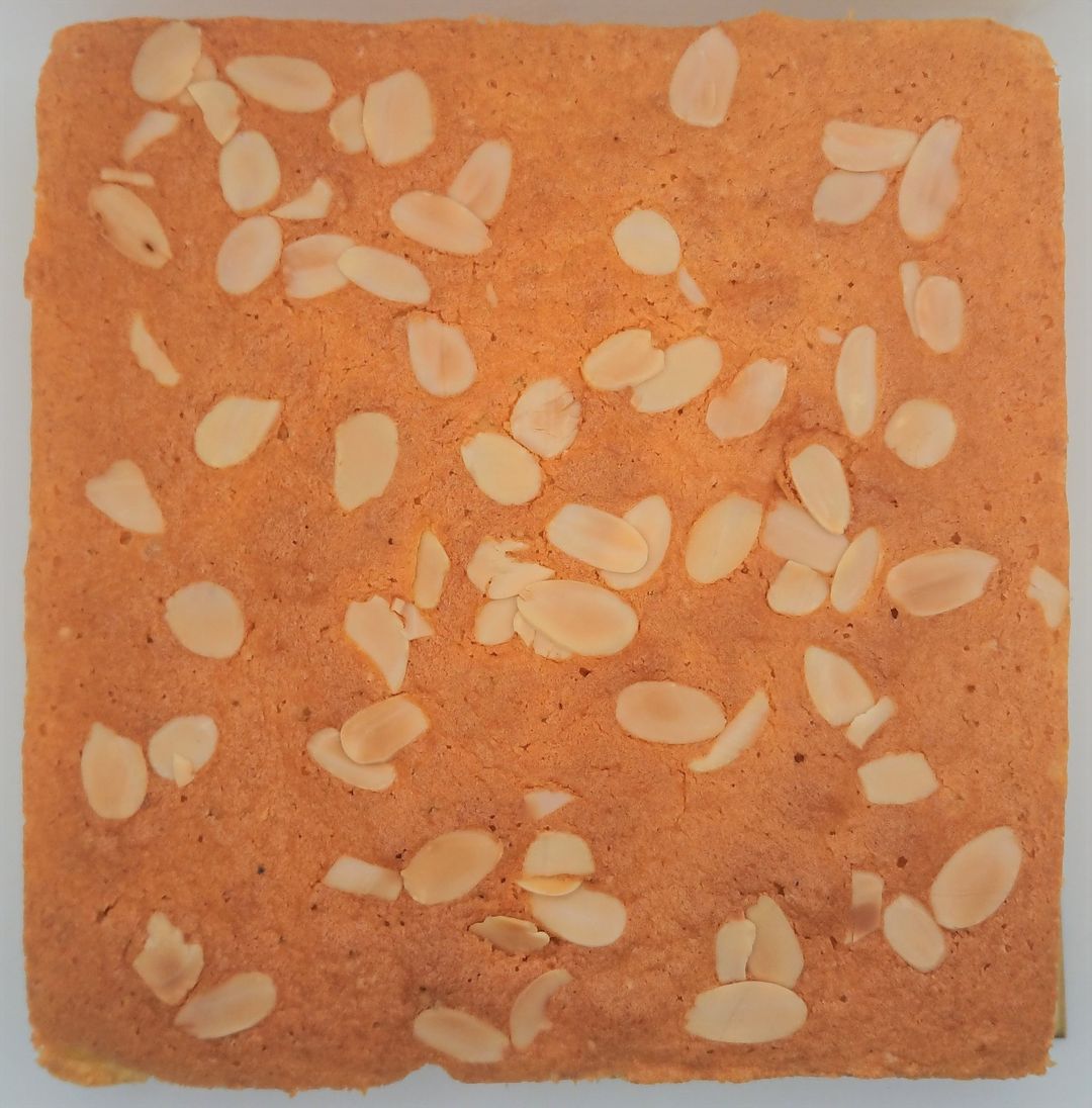 Butter cake topped with almond flakes