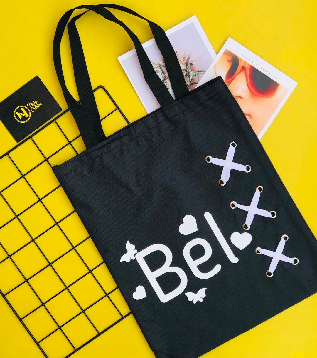 White prints tote bag with crisscross design 