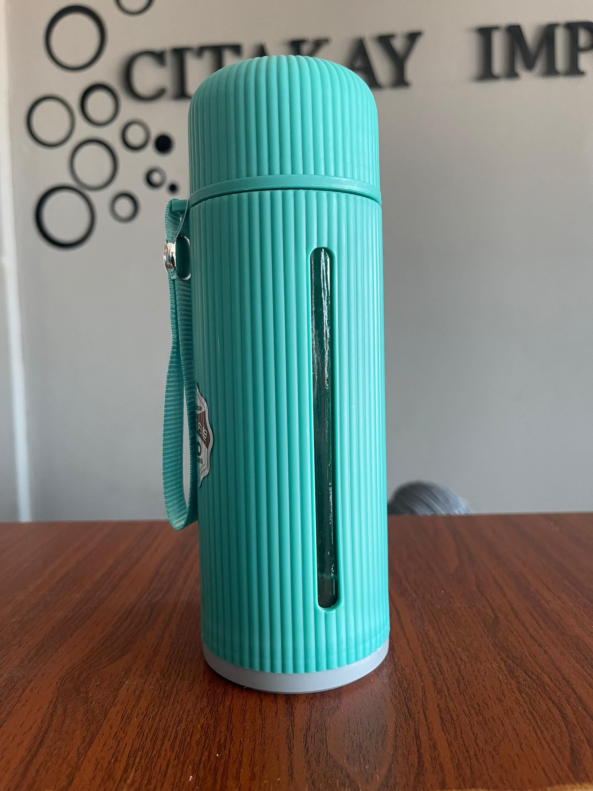  glass water bottle with plastic sleeve_0