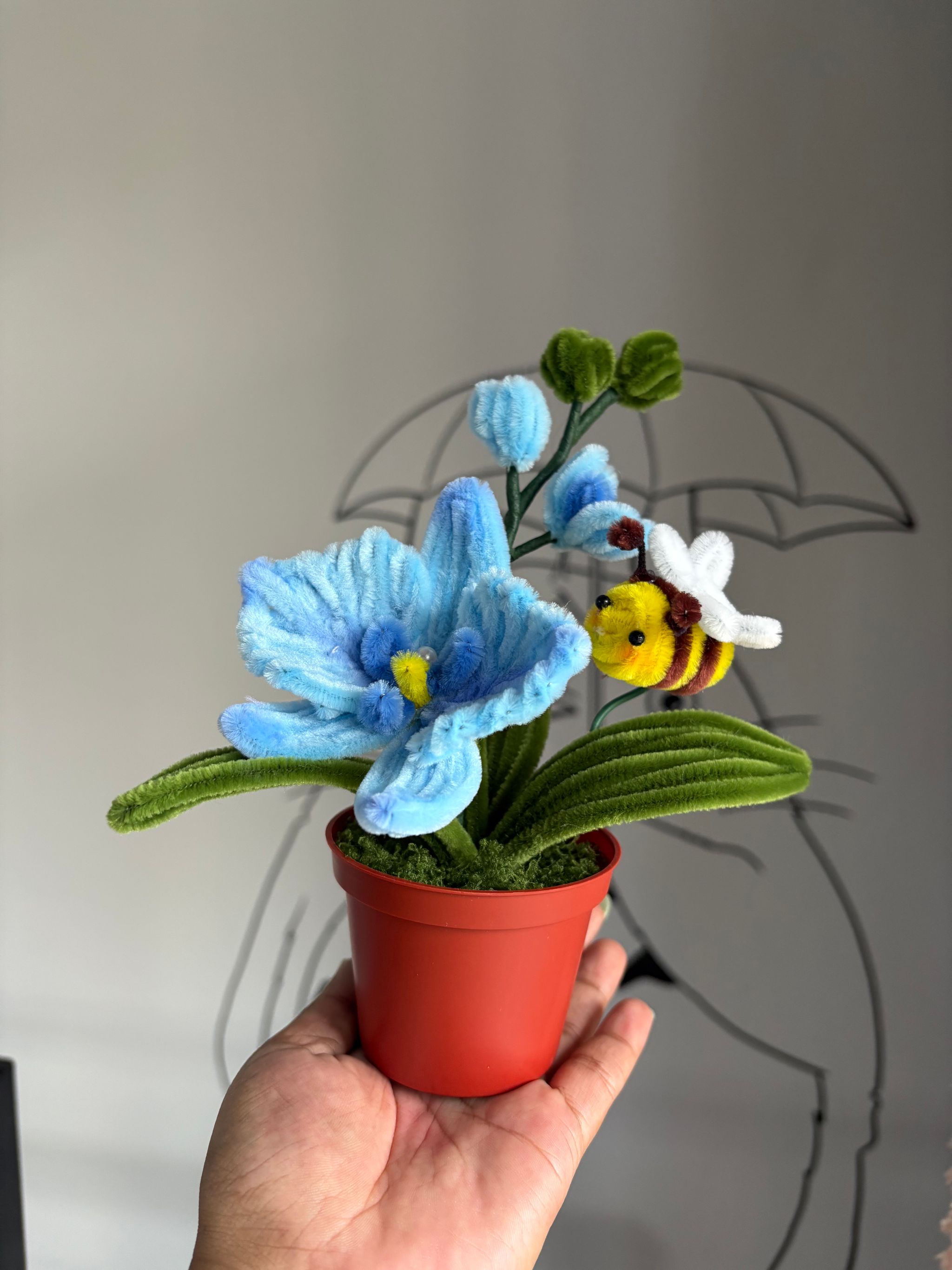 Blue orchid with bee pot _3