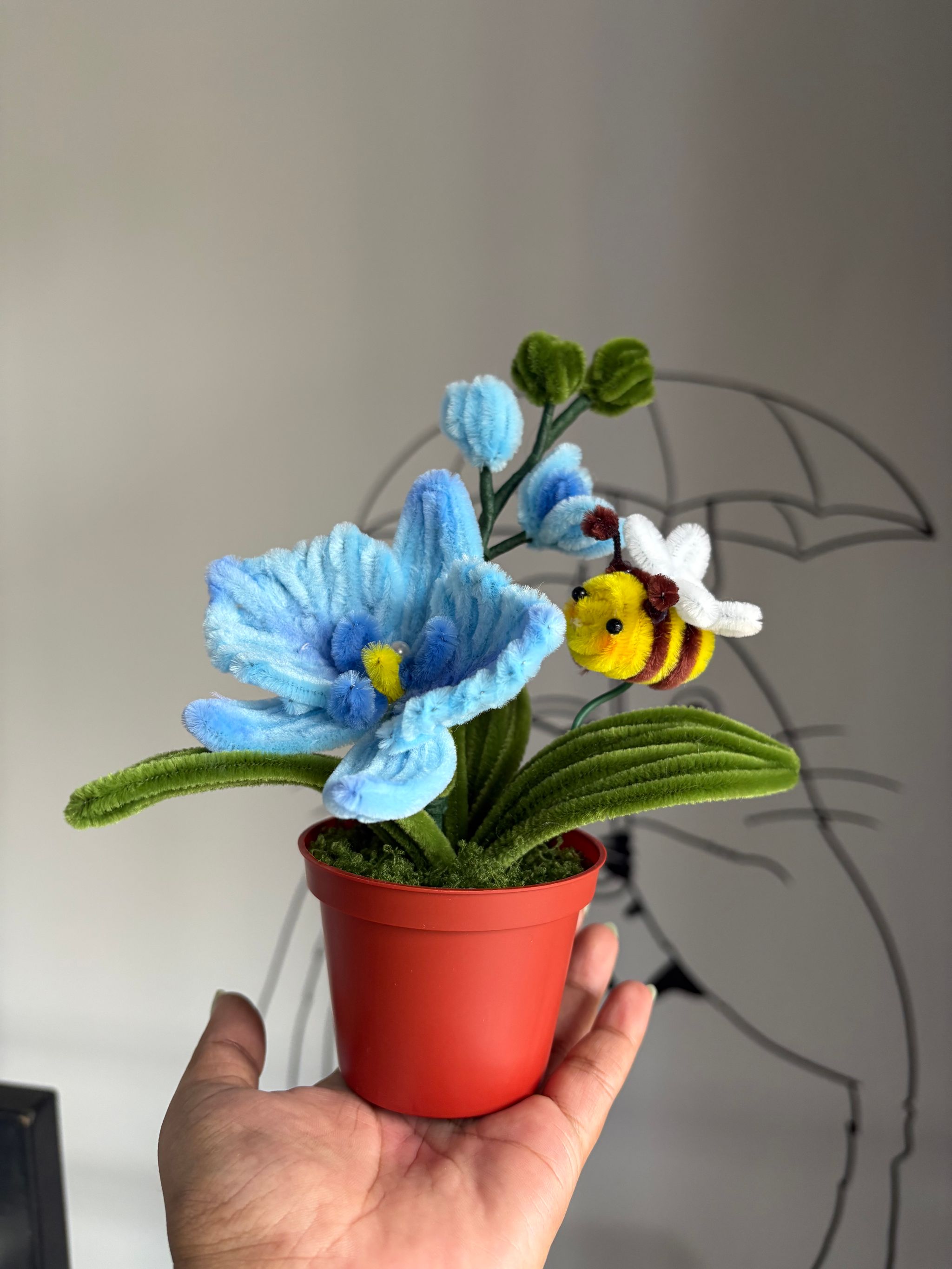 Blue orchid with bee pot _1