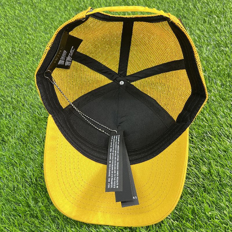 AMIRI CURVED PEAK YELLOW LOGO_1
