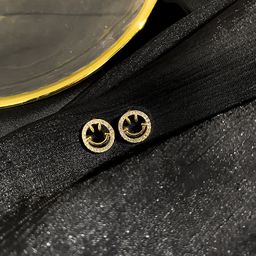 Smiley face stud earrings
