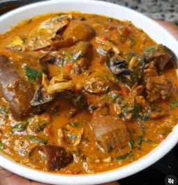 Ögbönö soup with swallow and protein of choice 