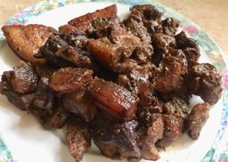 Steam Snapper and Pork Chops Served with Rice & Peas, Peppered Corn, Toss Salad and Water 