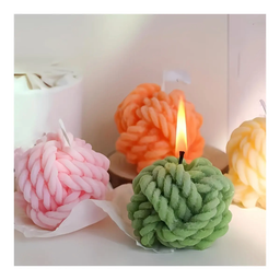 VELAS DECORATIVA EN FORMA DE ROLLO DE TEJER