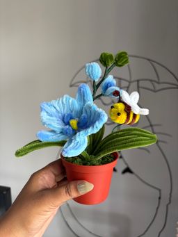 Blue orchid with bee pot 