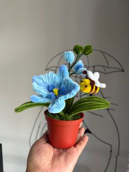 Blue orchid with bee pot 
