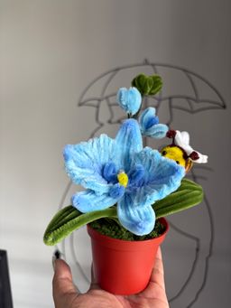 Blue orchid with bee pot 