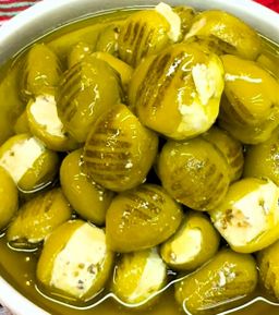 Grilled Green Olives Stuffed With Labnah Dipped in Olive Oil