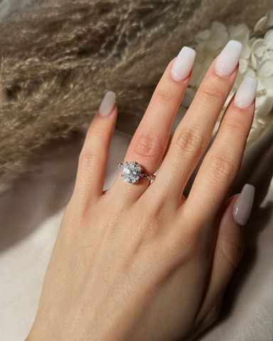 OVAL SOLITAIRE W/ DIAMOND RING