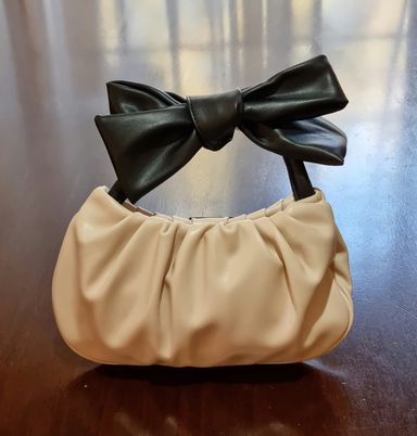 Black and ivory small clutchbag with bow