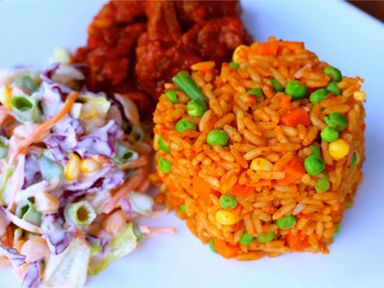 Jollof rice and chicken (with plantain or salad)