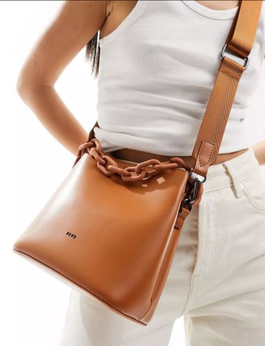 PASQ bucket bag with chain top handle and detachable crossbody strap in tan