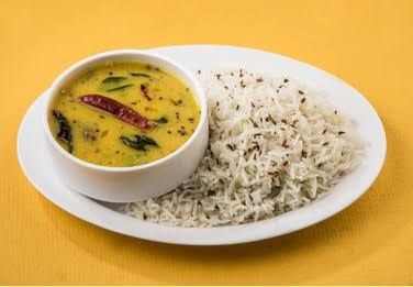 Daal Chawal with chicken Shami kebab, salad and achar