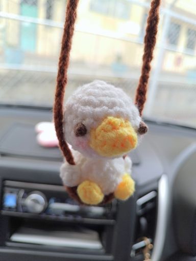 Swinging duckling car ornament 