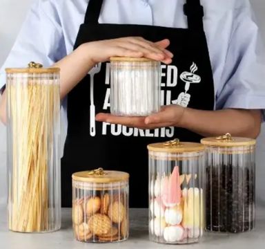 A SET OF KITCHEN STORAGE GLASS CONTAINERS 