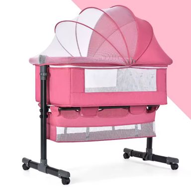 Baby besides crib bed 