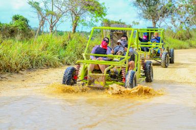 {FAMILY BUGGY FOR 3-4 }  Get ready for a wild ride! You'll drive your own buggy through muddy trails, explore a hidden cave, visit a traditional Dominican house for local tastings (like coffee, cacao & mamajuana), and finish off with a swim at the stunning Macao Beach. Adventure, culture, and fun—all in one tour!